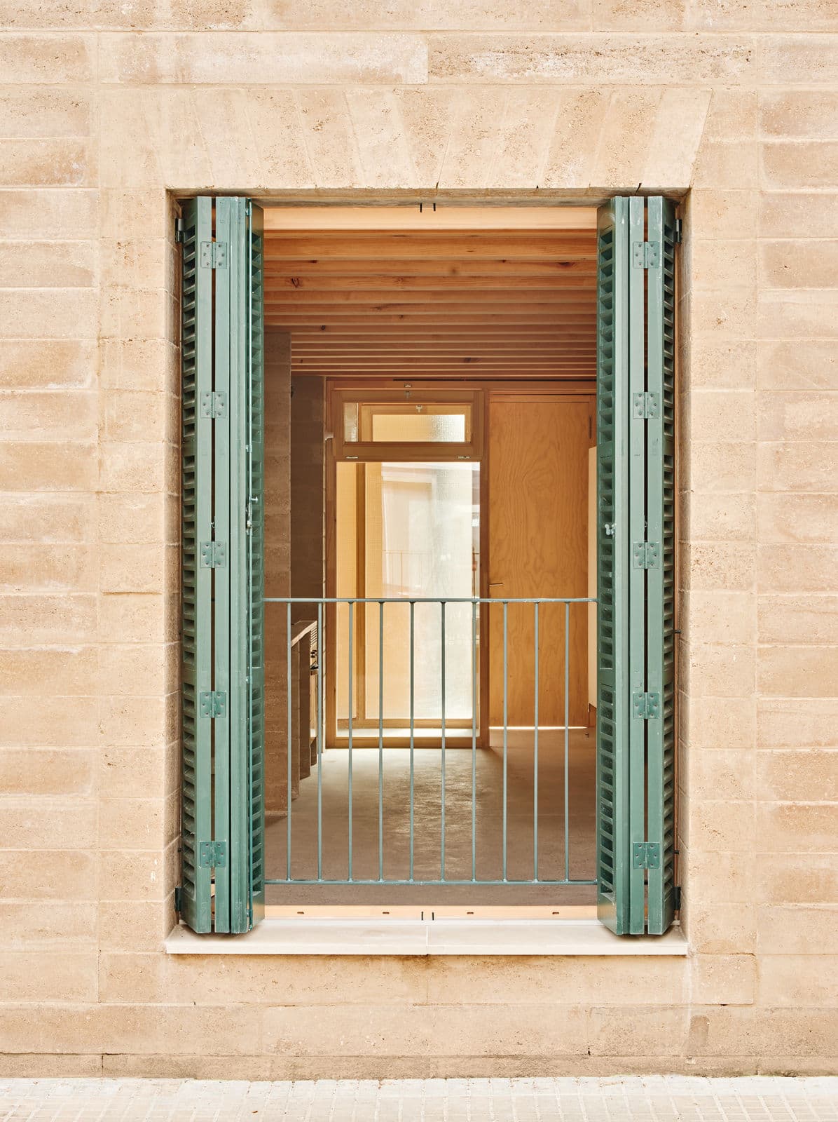Architectural project - green shutters, terrace, balcony, open shutter, exposed timber, sand tone, natural facade, apartment entrance, clean architecture, urban dwelling, ecological home, interior transition, architectural detail, wood, timber, sustainable design, glass, warm tones, eco design, green, neutral tones, daylight, beige, light wood, rustic charm, light brown, minimalist design, exterior, cozy space, rammed earth, natural material, earthy texture, modern rustic, biophilic design, passive house, natural ventilation, timber cladding, textured wall, wooden interior, wood walls, inviting space, warm atmosphere, clay, Mediterranean style, exterior view, residential space, bright interior, simple lines