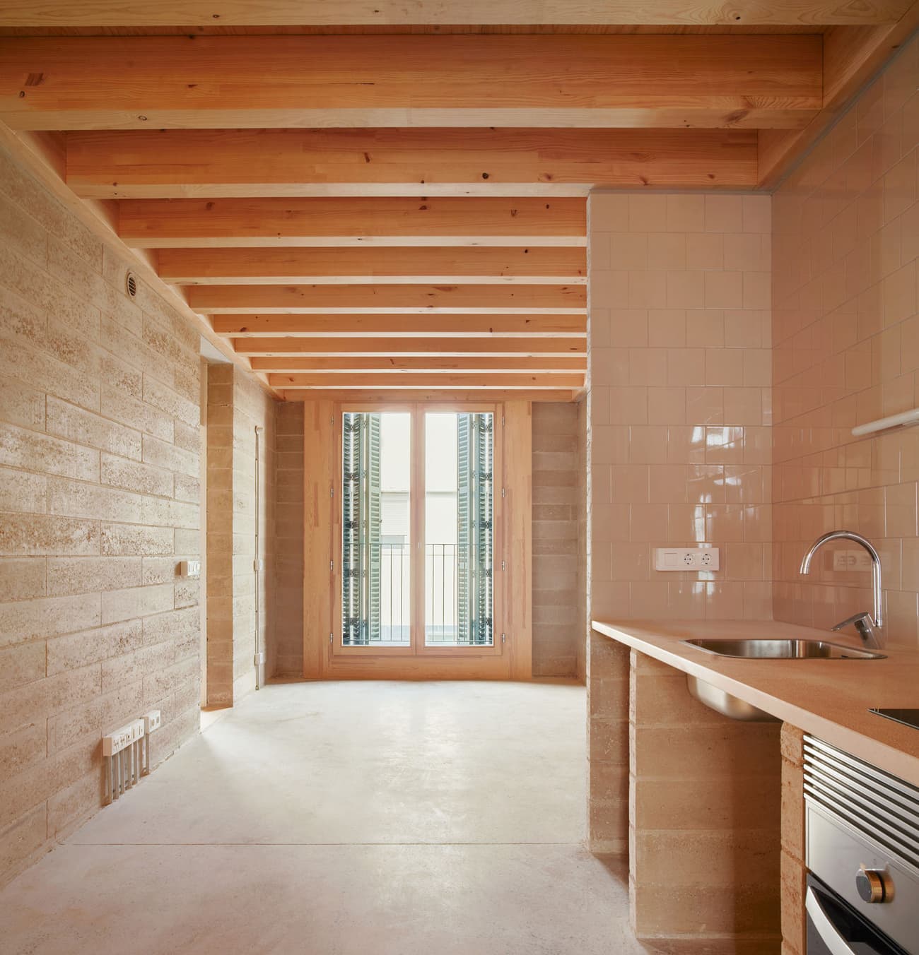 Architectural project - natural materials, wood, timber, raw materials, natural light, rustic touch, sustainable design, warm tones, contemporary style, neutral tones, exposed beams, daylight, timber ceiling, beige, light wood, eco friendly, Scandinavian influence, simple design, honey wood, wood beams, timber beams, rustic modern, minimalist style, light brown, glass doors, modern rustic, Nordic design, cozy vibe, textured wall, plaster wall, stone, plaster, open layout, open plan, inviting space, green home, earthy tones, stone wall, warm vibe, stone floor, bright interior, compact kitchen, sliding doors, wood ceiling, small kitchen, interior design, renovation, modern interior, kitchen, stone texture, remodel, comfortable space, practical layout, kitchen renovation, light flooring