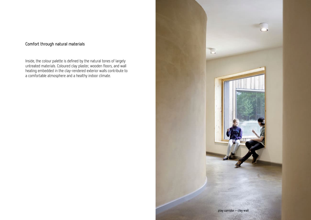 Architectural project - warm interior, natural materials, soft lighting, wood, timber, raw materials, grey, passive design, sustainable design, eco design, neutral tones, daylight, beige, peaceful setting, contemporary interior, minimalist design, casual seating, relaxed atmosphere, natural ventilation, large window, plaster wall, plaster, cozy nook, clay, natural texture, cozy corner, reading nook, seating area, residential space, curved wall, minimal corridor, simple hallway, relaxed ambiance, modern natural, soft light, clay wall, window seat, welcoming space, laid-back vibe, inviting environment, wellness focused, indoor air quality, healthy building, home corridor, modern comfort, serene interior