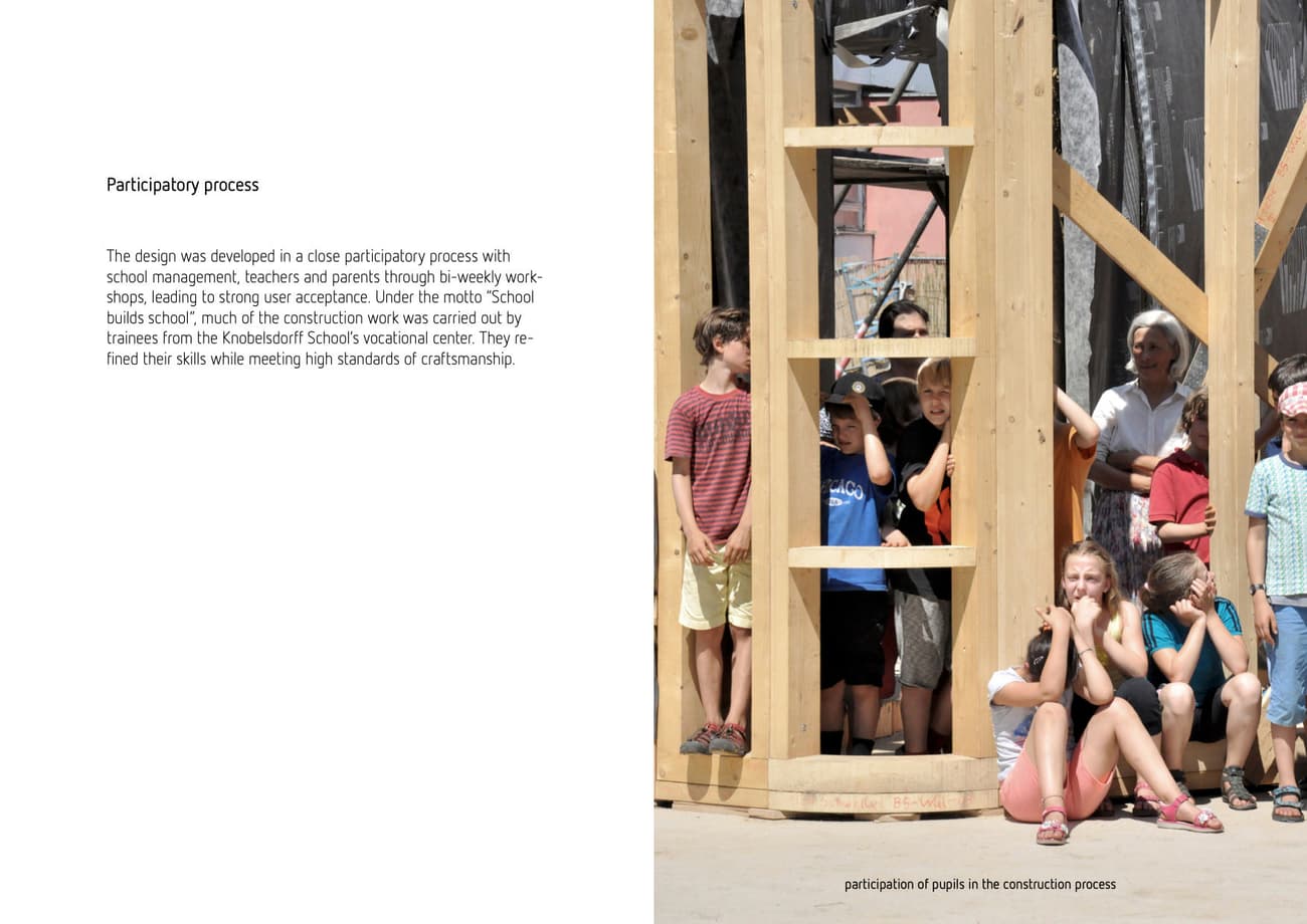 Architectural project - wood, timber, scaffolding, wooden frame, timber structure, neutral tones, modern construction, open frame, construction process, beige, light wood, wooden beams, eco-friendly construction, sustainable building, natural material, child friendly, urban architecture, educational architecture, architectural process, community project, skill development, structural framework, architectural education, modern school, participatory design, community involvement, school architecture, vocational training, educational project, hands-on learning, student participation, building workshop, local engagement, children's project, collaborative building, site activity, framing construction, playground design, sustainability education, youth architecture, practical education, community collaboration, experiential learning, school construction, participatory architecture, interactive project, open assembly