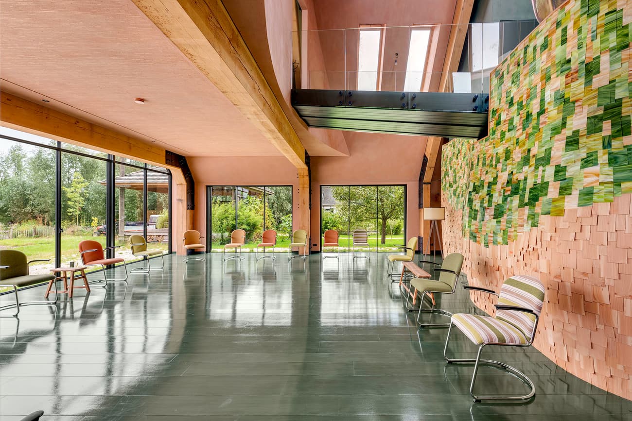 Architectural project - metal railing, floor to ceiling windows, meeting room, glossy floor, creative design, gathering place, wooden details, mezzanine, green tiles, creative workspace, colorful furniture, eclectic chairs, vibrant seating, artistic wall, mosaic wall, bright green, stripe pattern, reflective floor, innovative ceiling, multicolored, welcoming vibe, art driven, pastel pink, cozy interior, pink, wood, timber, natural light, sustainable design, glass, green, exposed beams, daylight, light wood, eco friendly, airy design, wooden beams, timber beams, social space, relaxed atmosphere, community center, biophilic design, large windows, modern architecture, textured wall, open layout, open plan, glass walls, nature-inspired, spacious interior, lounge area, soft pink, modern interior, contemporary space, ceramic, high ceiling, double height, modern materials