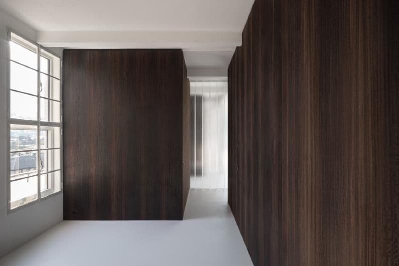 Architectural project - refined style, subtle elegance, city view, smooth surface, tranquil interior, dark timber, sleek wall, apartment interior, moody atmosphere, sophisticated interior, intimate space, architectural detail, timber, natural light, warm tones, grey, neutral tones, brown, compact space, sunlight, neutral palette, contemporary interior, minimalist design, serene space, warm wood, clean lines, timber cladding, wood cladding, elegant design, white, modern architecture, large window, cozy nook, timber interior, minimalist space, bright interior, sleek design, residential, home interior, open window, timber wall, modern minimalist, wood panel, dark tones, geometric form, dark wood, urban apartment