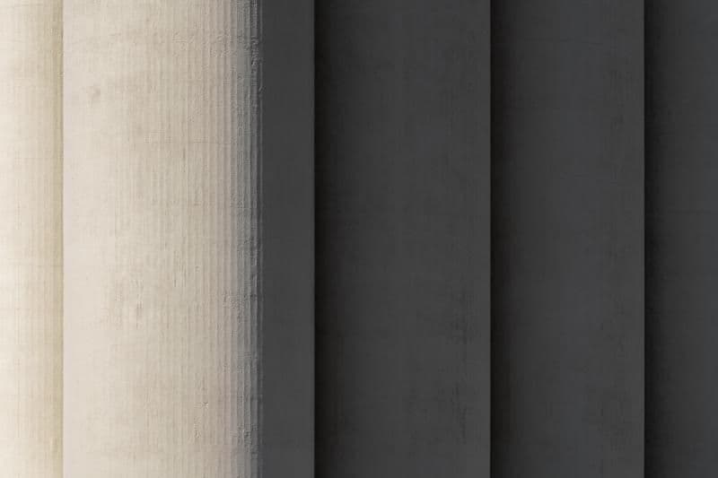 Architectural project - linear design, exposed concrete, raw concrete, vertical lines, striking design, concrete texture, materiality, texture, modernist design, brutalist architecture, pillar, concrete column, architectural column, monolithic structure, rhythm, symmetry, facade element, bold structure, strong presence, grey tones, industrial design, shadow play, contemporary architecture, grey, industrial vibe, light and shadow, modern design, minimalist style, neutral palette, urban design, structural element, robust design, sleek design, timeless design, urban architecture, texture contrast, architectural feature, architectural form