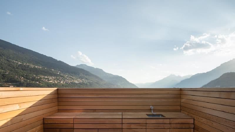 Architectural project - mountain view, scenic backdrop, roof terrace, serene ambiance, scenic setting, wooden terrace, modern terrace, contemporary terrace, tranquil spot, roof deck, private terrace, relaxation space, natural materials, leisure area, sustainable materials, raw materials, outdoor space, outdoor living, passive design, sustainable design, warm tones, neutral tones, daylight, beige, exterior design, light wood, natural wood, eco friendly, sunlight, simple design, honey wood, minimalist vibe, minimalist design, natural finish, timber panels, wood panels, eco home, scenic view, clean lines, timber cladding, panoramic view, outdoor kitchen, natural environment, wooden cladding, sleek design, wooden deck, fresh air, outdoor retreat, open view, exterior space