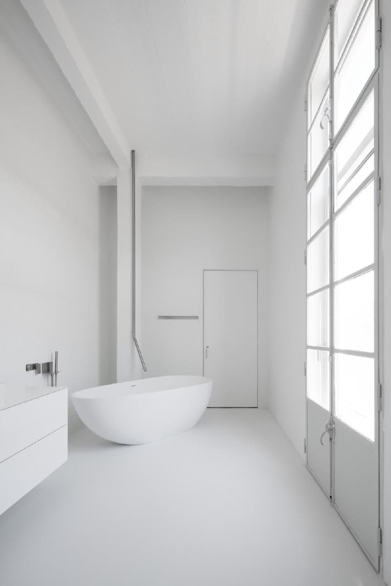 Architectural project - floor to ceiling windows, relaxing environment, white bathroom, home bathroom, residential bathroom, crisp design, minimalist bathroom, freestanding tub, white palette, bathtub, peaceful space, minimal fixtures, modern fixtures, tranquil, luxury bathroom, high-end finishes, calming atmosphere, spa retreat, grey, neutral tones, minimalist vibe, contemporary design, zen space, minimalist style, neutral colors, light tones, clean lines, light filled, simple elegance, white, modern architecture, open layout, minimalist decor, sleek design, bright space, modern style, smooth surfaces, indoor, modern bathroom, soaking tub, spa-like, serene bathroom, streamlined, airy, uncluttered space