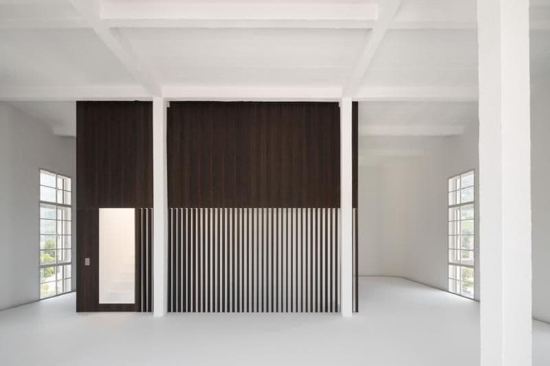 Architectural project - linear design, floor to ceiling windows, industrial loft, airy interior, modern loft, loft space, white interior, modernist touch, monochrome palette, spacious room, white beams, dark brown, minimalistic vibe, sleek aesthetic, blank canvas, studio space, wood, timber, natural light, warm tones, exposed structure, neutral tones, Scandinavian influence, contemporary design, neutral palette, minimalist design, black, creative space, clean lines, light filled, large windows, wood cladding, white, architectural details, open plan, open space, vertical slats, dark wood, versatile space, high ceiling, double height, urban style