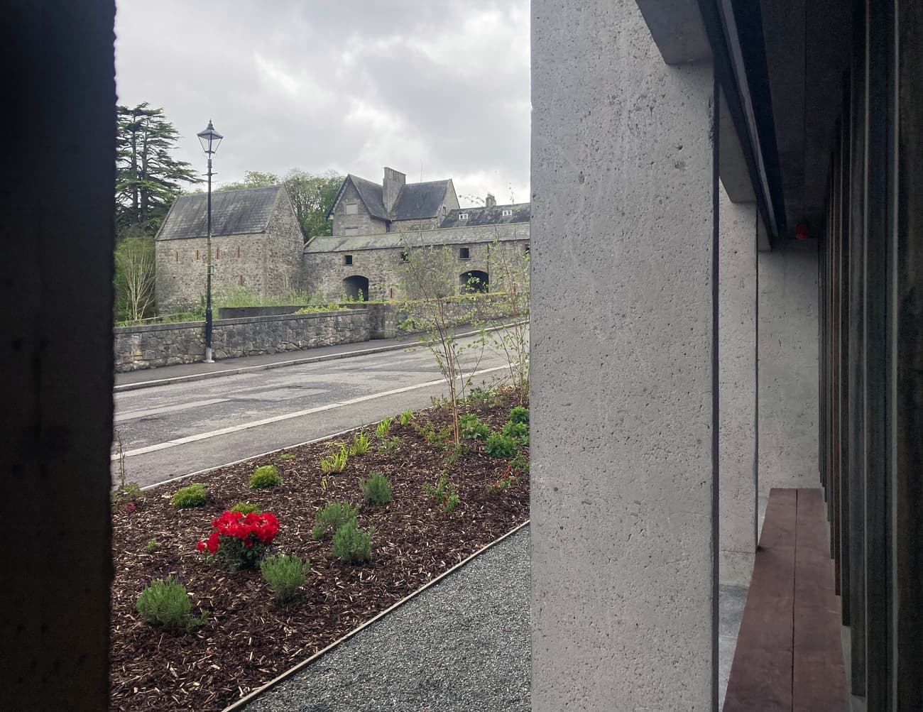 Architectural project - natural stone, scenic backdrop, concrete texture, concrete walls, landscaped garden, cultural heritage, heritage conservation, architectural heritage, historic vibe, heritage site, medieval style, stone building, pathway design, courtyard garden, historical site, castle-like, cityscape, outdoor space, sustainable design, grey, rustic charm, serene atmosphere, public space, outdoor seating, adaptive reuse, urban design, eco-friendly materials, modern facade, window view, traditional architecture, landscape design, exterior view, grey stone, timeless design, architectural contrast, muted tones, street view