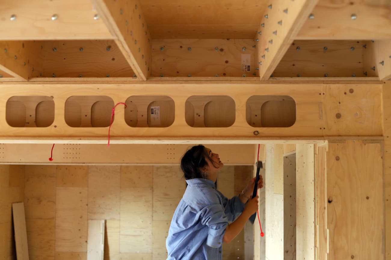 Architectural project - plywood walls, raw aesthetics, construction zone, plywood construction, structural frame, interior framing, timber framework, architectural structure, unfinished project, building phase, home building, natural materials, wood, timber, raw materials, natural tones, modular design, neutral tones, construction site, exposed beams, modern construction, plywood, construction process, building site, beige, structural design, industrial style, minimalist construction, timber construction, timber beams, construction details, carpentry work, low carbon construction, unfinished interior, sustainable building, eco construction, structural beams, woodwork, passive house, timber house, structural integrity, wooden structure, wooden building